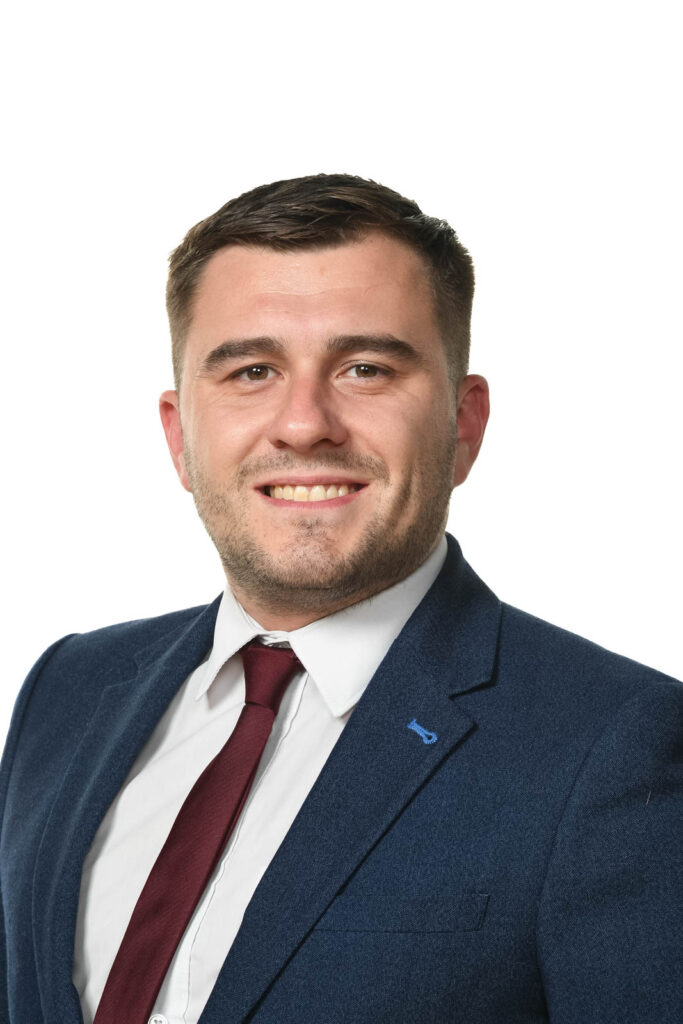 Portrait headshot photo of Adam Hicks, senior business Manager. White background.