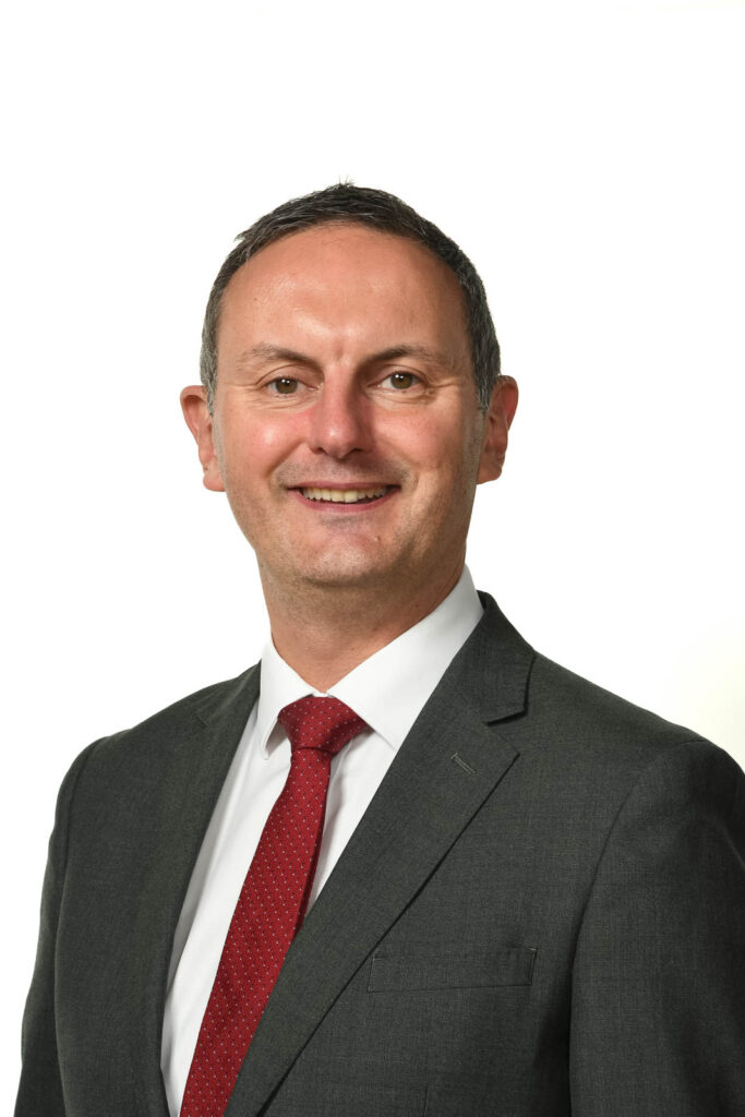 Portrait headshot photo of Mr Clinton, Headteacher. White background.