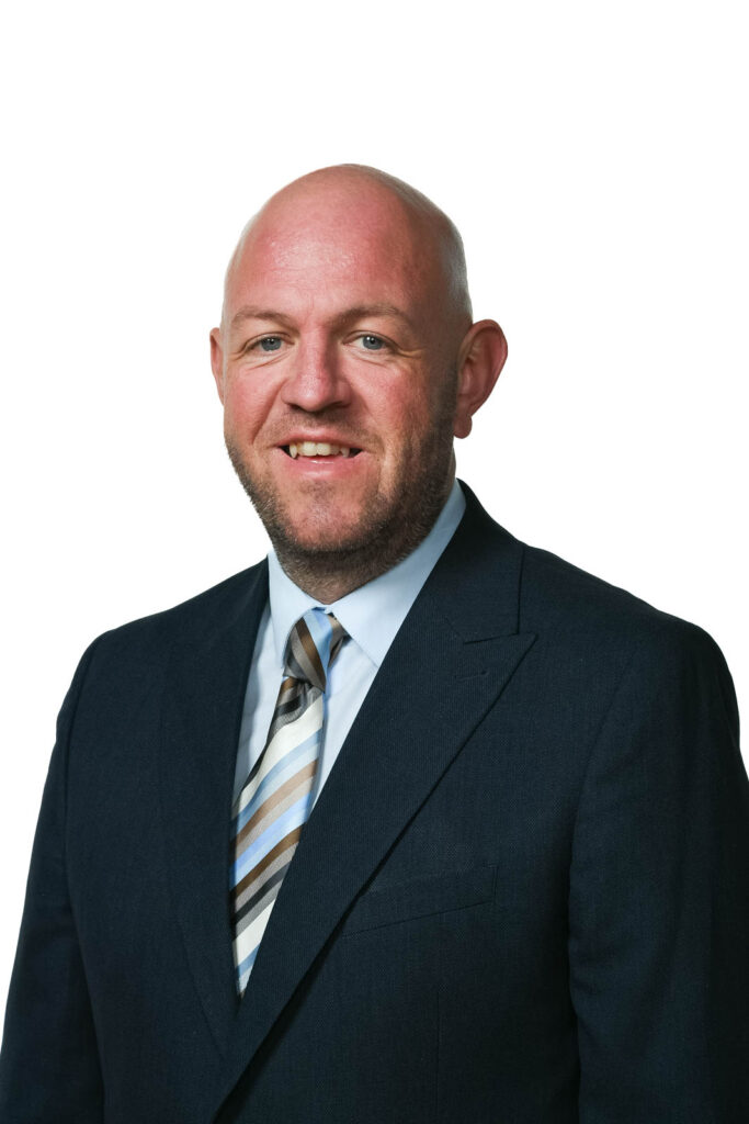 Portrait headshot photo of Dan Corrigan, assistant headteacher. White background.